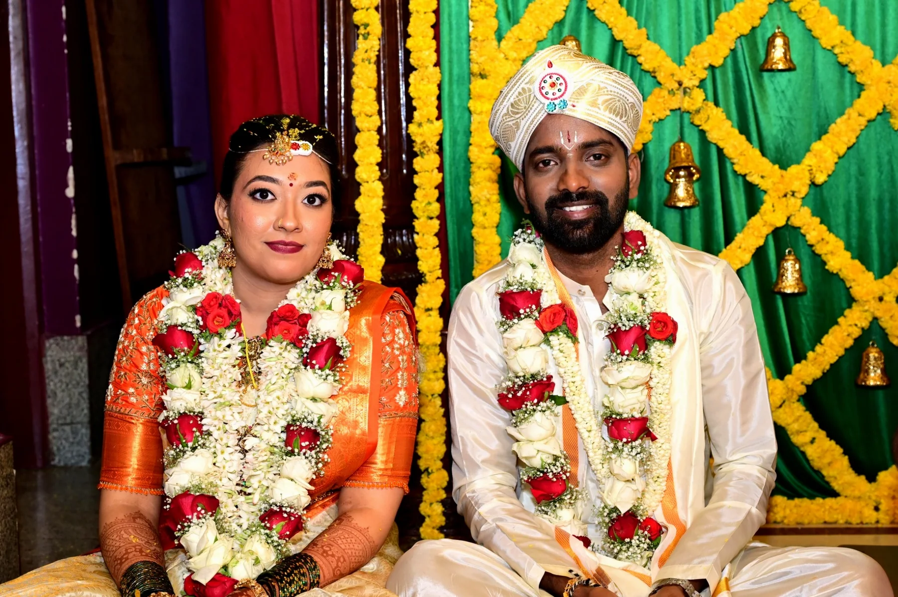 Traditional wedding couple seated during ceremony