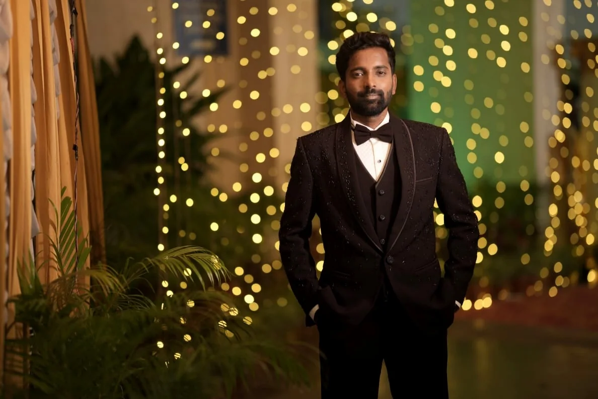 Groom portrait in a dark formal suit