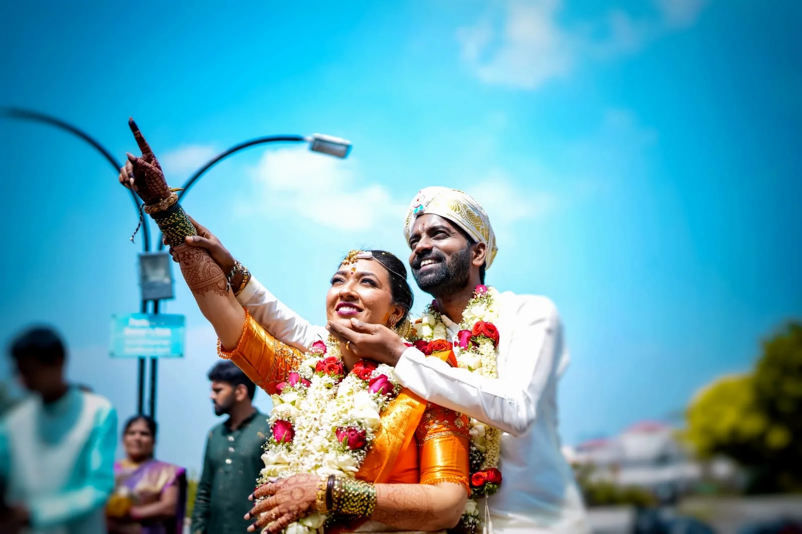 Newly married couple celebrating outdoors